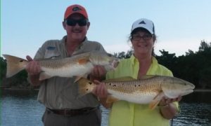 couple fishing with com'n'getit fishing charters