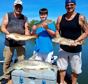 Redfish and shark caught on Daytona Beach fishing charter